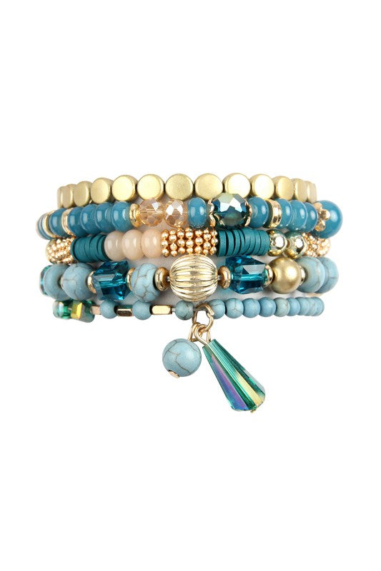 This is a photo of ta Multi Beads Stretch bracelet in teal which features metal, acrylic and natural stone beads in teal, gold and pink.  