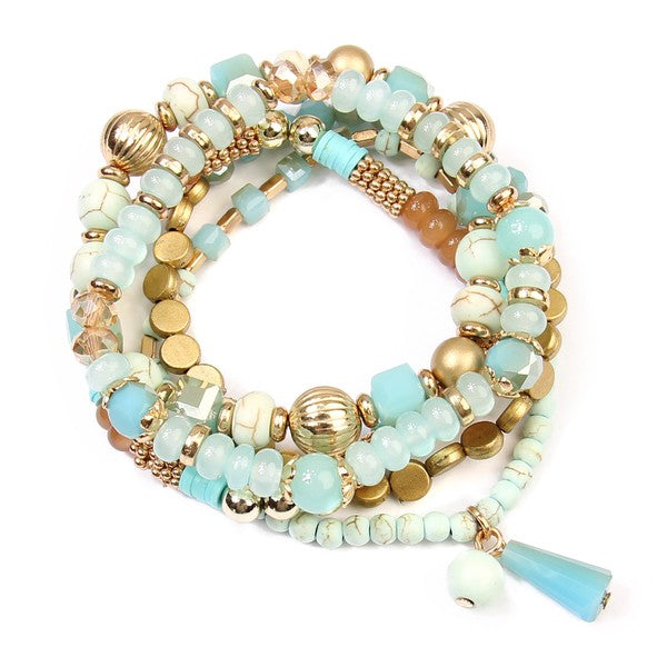 This is a photo of ta Multi Beads Stretch bracelet in gray which features metal, acrylic and natural stone beads in turquoise, gold and brown.  