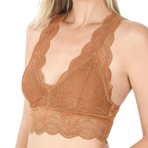 This is a photo of a model wearing a Strech Lace Bralette in coffee brown. The bra has a traditional spaghetti strap, v shaped neckline and features extra wide lace camisole straps and bottom lace band.